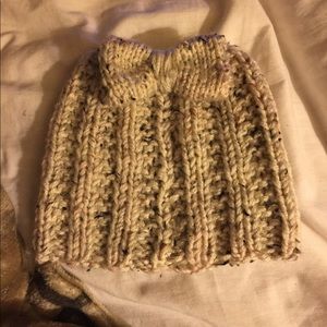 Hand knitted messy bun hat